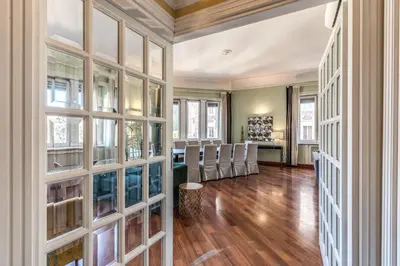 an empty room with glass doors and a dining room at DOWNTOWN SRL - Imperial Panorama Penthouse in Rome
