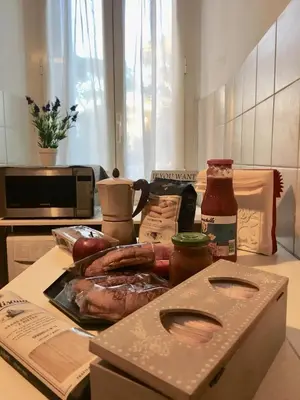 a table with a box of food on a counter at Chic 'N Charme Trastevere Terrace in Rome