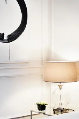 a lamp on a table next to a mirror at The Shire Hotel in Rome