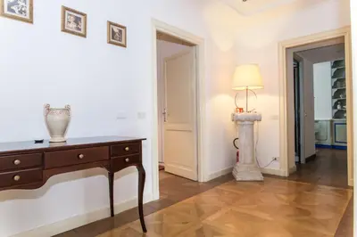 a room with a dresser and a lamp on a table at Casa Tranquilli in Rome