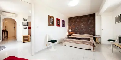 a bedroom with a bed and a wall at Trastevere Station Terrace in Rome