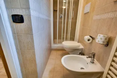 a bathroom with a toilet and a sink at Hotel Terminal in Rome