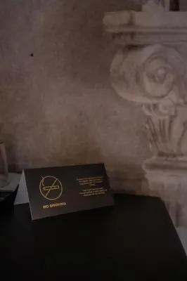 a black box sitting on top of a table at Relais Manzoni in Rome