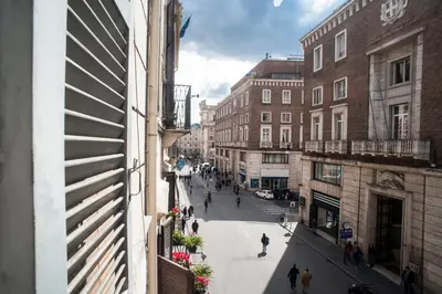 a view of a city street from a building at Santa Cecilia Apartment in Via del Corso in Rome