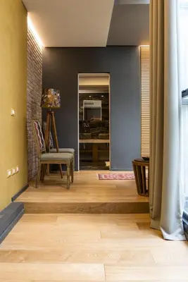 a living room with a chair and a table at Loft Spazio Panieri Unique place in Trastevere in Rome