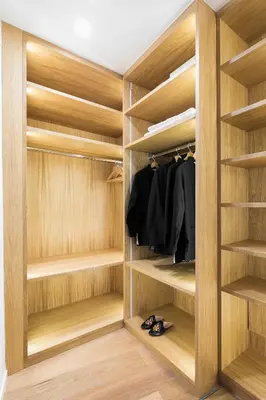 a walk in closet with wooden shelves at Loft Spazio Panieri Unique place in Trastevere in Rome