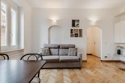 a living room with a couch and a table at Giulia's holidays in Rome