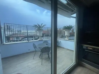 a room with a balcony with a table and chairs at Residence Lodi in Rome