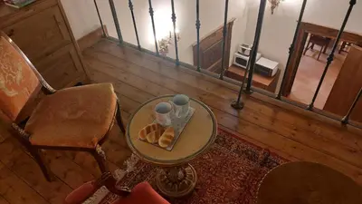 an overhead view of a room with a table and a chair at Residenza Sinibaldi - XVII century experience in Rome
