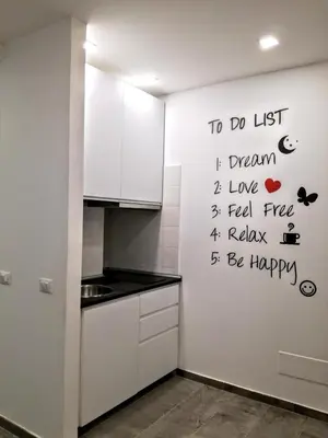 a kitchen with the words to do list i dream i love i feel rise i at CIVICO 7 Holiday Rooms in Rome