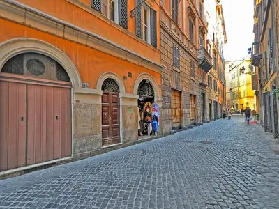 a cobblestone street in an alley with buildings at Terrace Governo Vecchio in Rome