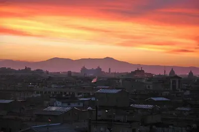 a view of a city at sunset at Penthouseinrome in Rome