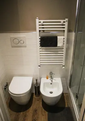 a bathroom with a toilet and a sink at St. Peter's Luxury Rooms in Rome
