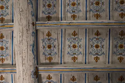 a wooden wall with blue and gold designs on it at Palazzo Caruso in Rome