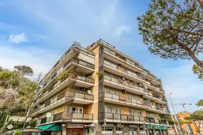 an apartment building with balconies on a street at Il Nido di Lulu in Rome