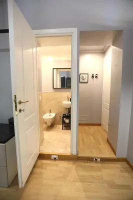 a bathroom with a toilet and a sink at KISS ME ROME Luxury Rooms in Rome