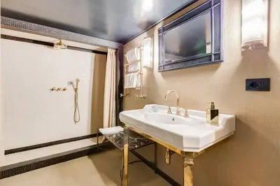 a bathroom with a sink and a shower at Luxurious loft facing the Pantheon in Rome
