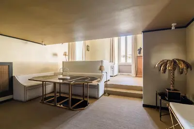 a living room with a table and a couch at Luxurious loft facing the Pantheon in Rome