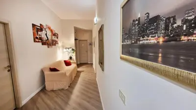 a living room with a couch and a picture on the wall at Myomax Guesthouse Hospety Group in Rome