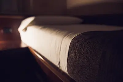 a close up of a bed with white sheets at Hotel Robinson in Rome