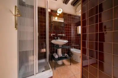 a bathroom with a sink and a toilet at Trastevere Apartments in Rome