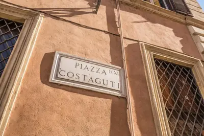 a street sign on the side of a building at Dimore Costaguti in Rome