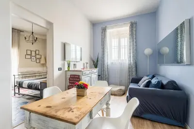 a living room with a couch and a table at Trastevere Stylish in Rome
