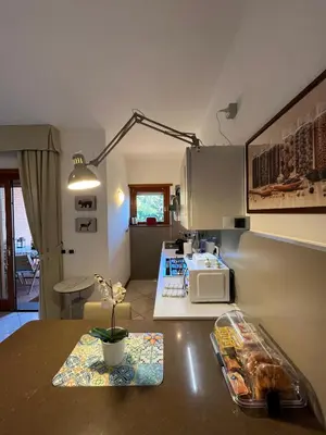 a kitchen with a counter top with a microwave at Residenza 