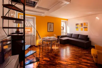 a living room with a couch and a table at Home D'elite Navona in Rome