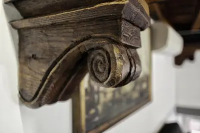 a wooden picture frame hanging on a wall at Home D'elite Navona in Rome