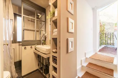 a bathroom with a sink and a window at Loft&Terrace - Elevated Elegance at Navona in Rome