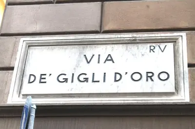 a street sign on the side of a building at Il Nido in Rome