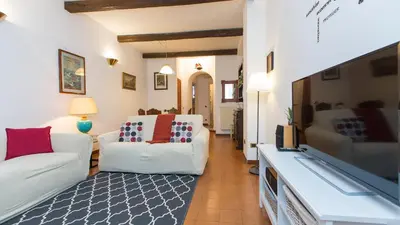 a living room with two white couches and a flat screen tv at Rental in Rome Panieri Terrace in Rome