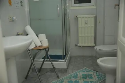 a bathroom with a shower and a sink and a toilet at B&B Bel Ami in Rome
