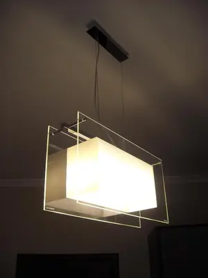a light that is hanging from a ceiling at B&B Il Granello Di Senape in Rome