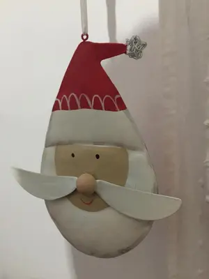 a santa claus ornament hanging on a wall at Lovely Irnerio ❤ flat near S. Pietro ★ in Rome