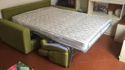 a bed sitting on top of a chair in a room at Lovely Irnerio ❤ flat near S. Pietro ★ in Rome