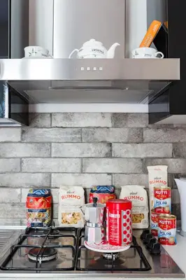 a stove top with some food on it in a kitchen at Sixty One Luxury Room in Rome