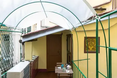 a building with an archway on a balcony at Art Apartment Navona Square in Rome