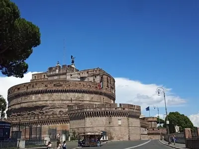 a large stone building with a statue on top of it at La Residenza Dell'Angelo in Rome