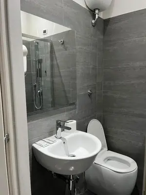 a bathroom with a sink and a toilet at Les Artes in Rome