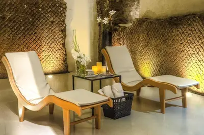two chairs and a table in a room at Hotel Lunetta in Rome
