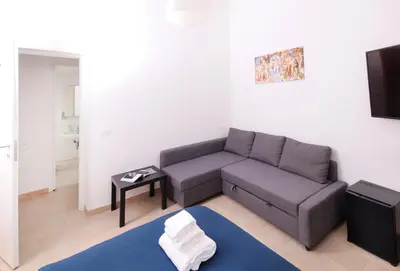 a living room with a couch and a table at Cielo Vaticano Guest House in Rome