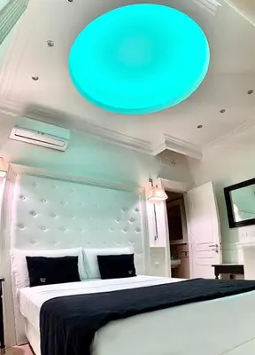 a blue frisbee hanging from the ceiling of a bedroom at Tito Suite Guest House in Rome