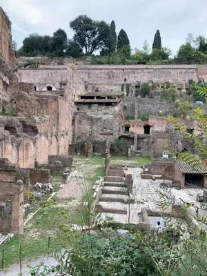 ancient ruins of a building with steps in front at Foro Romano Apartments B in Rome