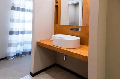 a bathroom with a white sink and a mirror at Unicum Vite in Rome