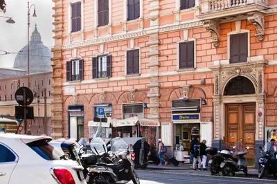 a group of motorcycles parked in front of a building at DaliTourism - Vatican Apartment 9 in Rome