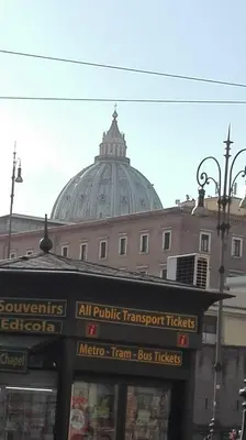 a large building with a domed building in the background at DaliTourism - Vatican Apartment 9 in Rome