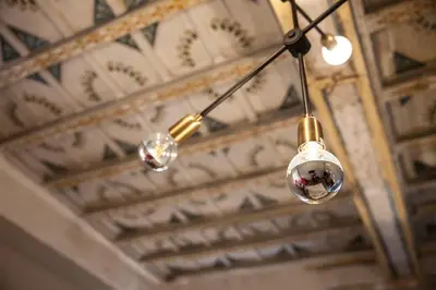 a chandelier hanging from the ceiling of a building at Casa Fabbrini Fancy Suites in Rome