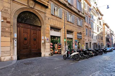 a row of motorcycles parked in front of a building at Roma Suite Monti in Rome